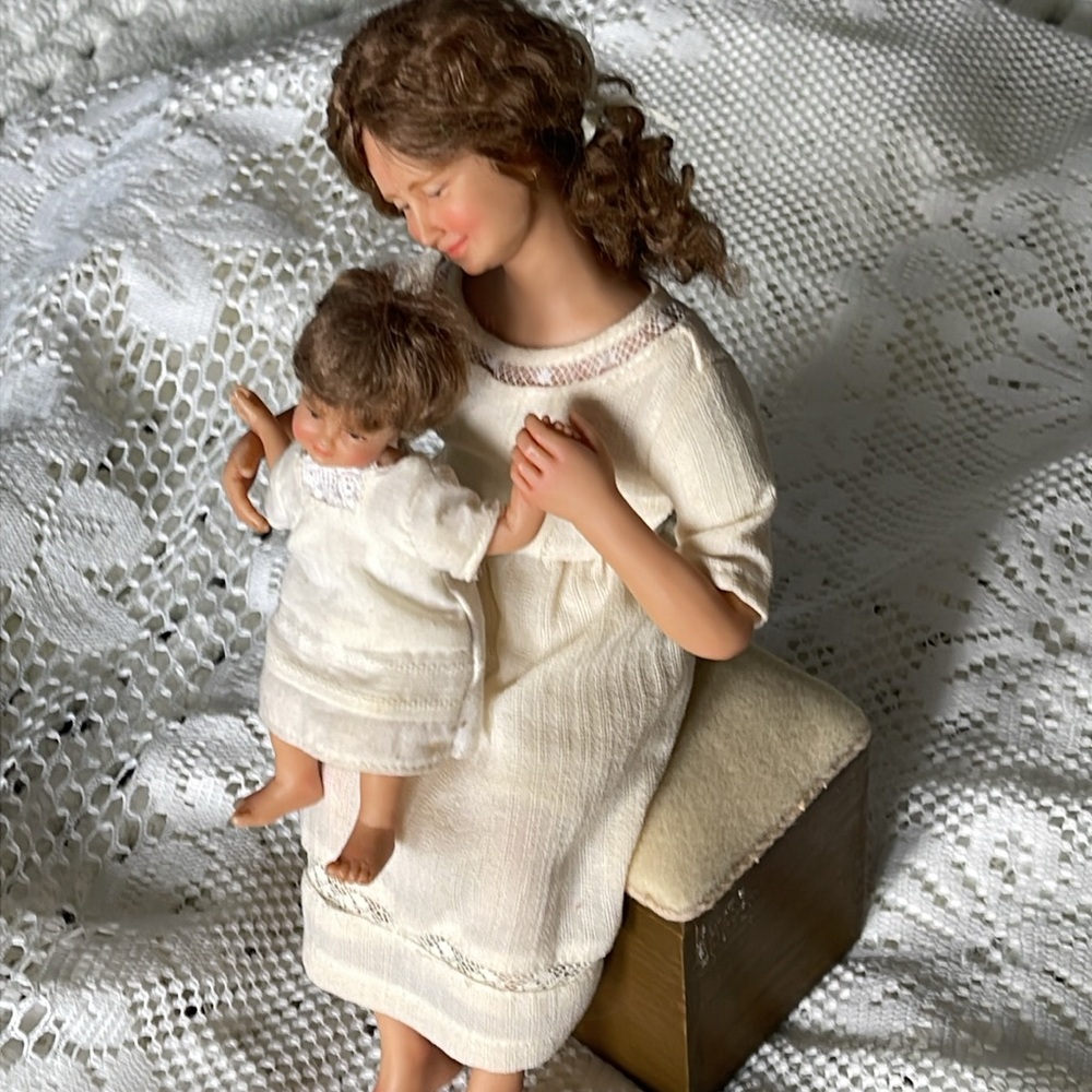 Vintage approx year 2000 Mother and child atop‎ upholstered bench. So endearing.